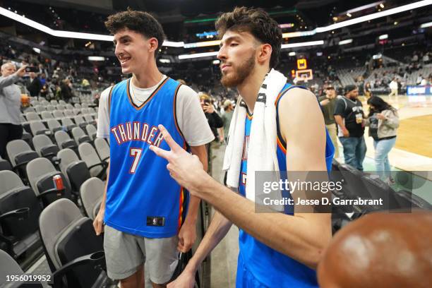 Chet Holmgren of the Oklahoma City Thunder poses for a photo with a fan after the game against the San Antonio Spurs on January 24, 2023 at the Frost...