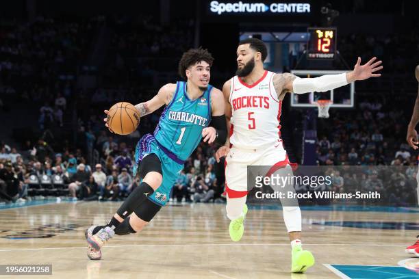 LaMelo Ball of the Charlotte Hornets drives to the basket during the game as Fred VanVleet of the Houston Rockets plays defense on January 26, 2024...