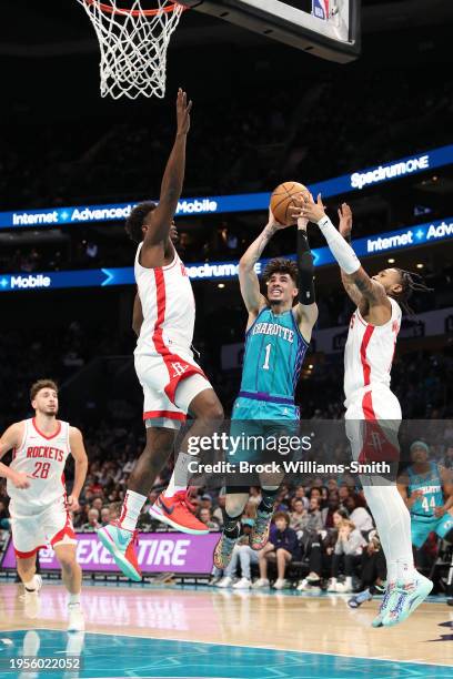 LaMelo Ball of the Charlotte Hornets drives to the basket during the game against the Houston Rockets on January 26, 2024 at Spectrum Center in...