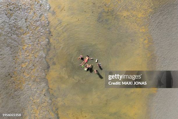 Aerial view of people under the sun on a beach in Puerto Madryn, Chubut province, Argentina on January 26, 2024. Argentine Patagonia, a huge...