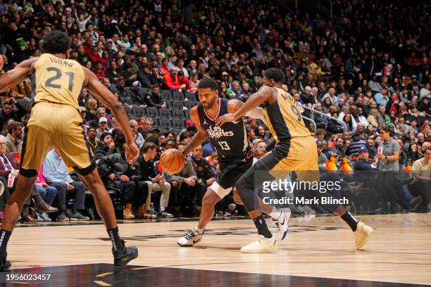 Paul George of the LA Clippers dribbles the ball during the game against the Toronto Raptors on January 26, 2024 at the Scotiabank Arena in Toronto,...