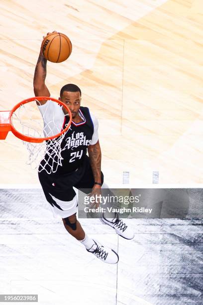 Norman Powell of the LA Clippers drives to the basket during the game against the Toronto Raptors on January 26, 2024 at the Scotiabank Arena in...