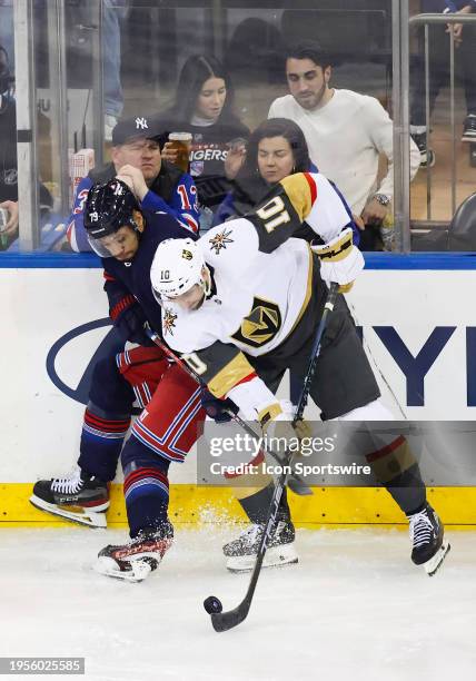 Vegas Golden Knights Center Nicolas Roy skates against New York Rangers Defenseman K'Andre Miller during the National Hockey League game between the...