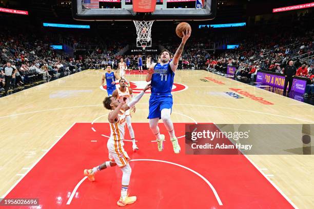 Luka Doncic of the Dallas Mavericks drives to the basket during the game against the Atlanta Hawks on January 26, 2024 at State Farm Arena in...