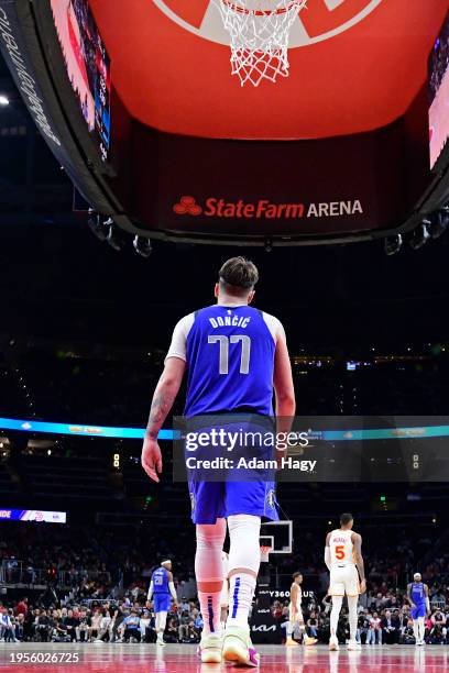 Luka Doncic of the Dallas Mavericks looks on during the game against the Atlanta Hawks on January 26, 2024 at State Farm Arena in Atlanta, Georgia....