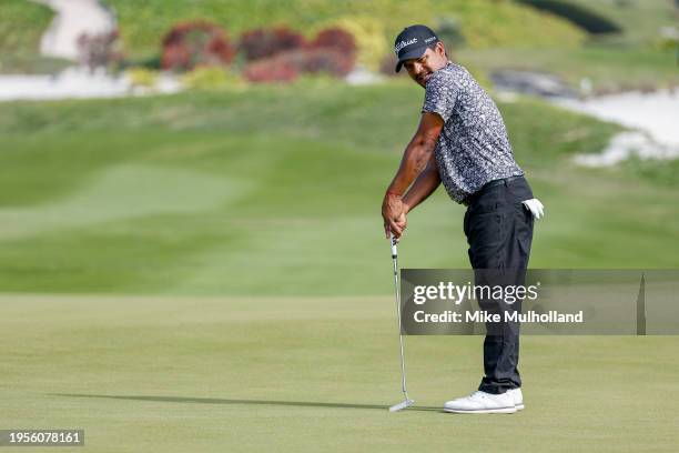Fabian Gomez of the United States reacts to a putt on the fourth hole during the third round of The Bahamas Great Abaco Classic at The Abaco Cub on...
