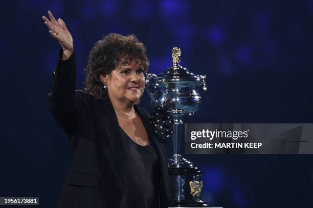 Australia's former tennis player Evonne Goolagong Cawley poses with the Daphne Akhurst Memorial Cup prior to the women's singles final match between...