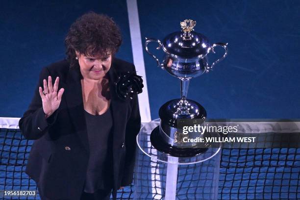 Australia's former tennis player Evonne Goolagong Cawley poses with the Daphne Akhurst Memorial Cup prior to the women's singles final match between...