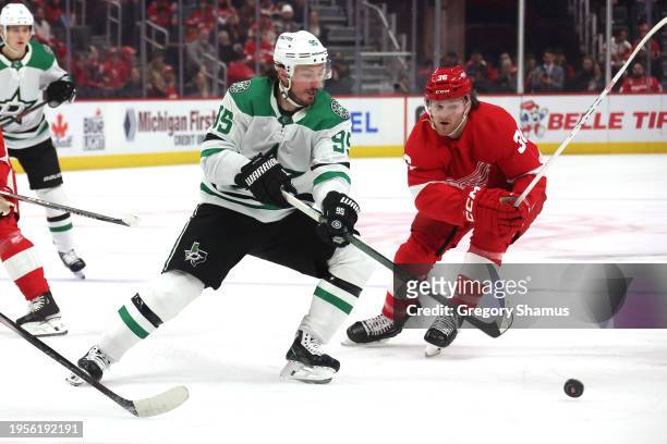 Matt Duchene of the Dallas Stars tries to get around the stick of Christian Fischer of the Detroit Red Wings during the first period at Little...