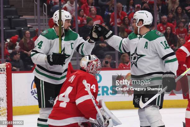 Jamie Benn of the Dallas Stars celebrates his first period goal with Joe Pavelski in front of Alex Lyon of the Detroit Red Wings at Little Caesars...