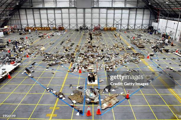 The handout photo provided by NASA shows an overview of the floor of the RLV Hangar where a small portion of the debris from the Space Shuttle...