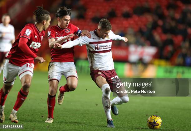 Patrick Brough of Northampton Town attempts to control the ball under pressure from George Dobson of Charlton Athletic during the Sky Bet League One...