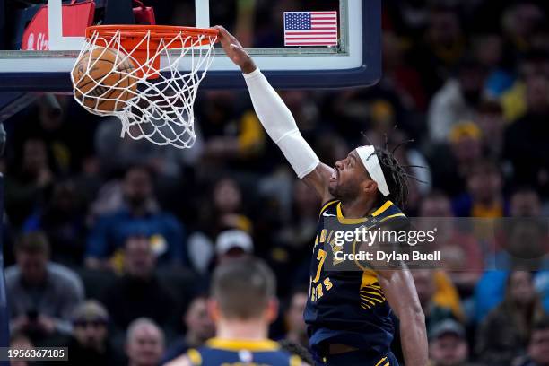 Buddy Hield of the Indiana Pacers dunks the ball in the second quarter against the Denver Nuggets at Gainbridge Fieldhouse on January 23, 2024 in...