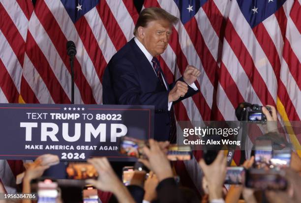 Republican presidential candidate and former U.S. President Donald Trump celebrates on stage during his primary night rally at the Sheraton on...