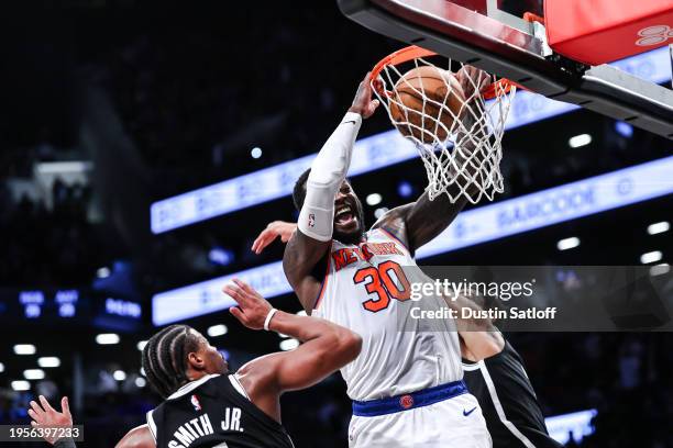 Julius Randle of the New York Knicks dunks the ball during the fourth quarter of the game against the Brooklyn Nets at Barclays Center on January 23,...