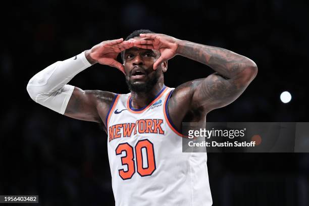 Julius Randle of the New York Knicks reacts after a dunk during the fourth quarter of the game against the Brooklyn Nets at Barclays Center on...