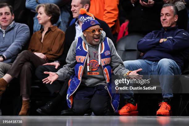 Spike Lee kneels on the ground during the fourth quarter of the game between the New York Knicks and the Brooklyn Nets at Barclays Center on January...