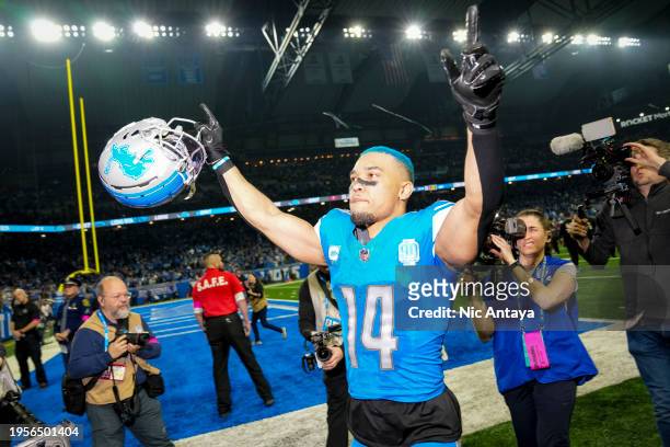 Amon-Ra St. Brown of the Detroit Lions waves to fans and leaves the field after the win against the Tampa Bay Buccaneers at Ford Field on January 21,...