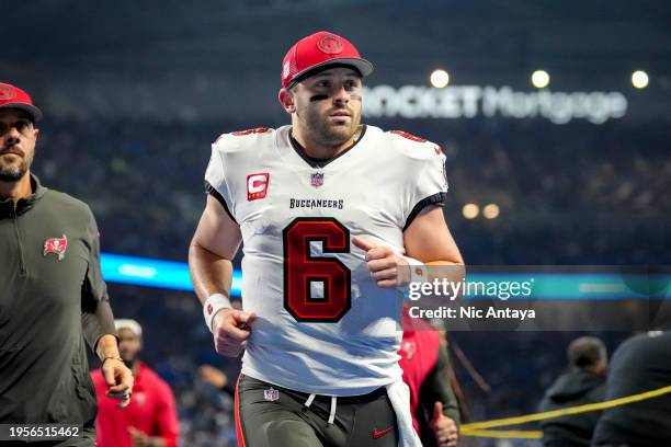 Baker Mayfield of the Tampa Bay Buccaneers runs off the field against the Detroit Lions at Ford Field on January 21, 2024 in Detroit, Michigan.