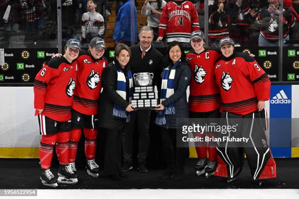 Katy Knoll, Abbey Marohn, Megan Carter, Gwyneth Philips and coach Dave Flint of the Northeastern Huskies pose for a photo with Boston Mayor Michelle...