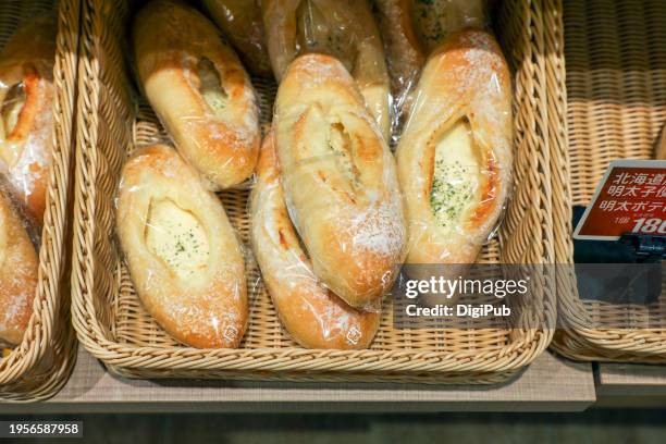 freshly baked cheese bread rolls in a basket - japanese language stock pictures, royalty-free photos & images