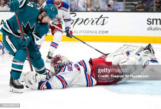 Goalie Igor Shesterkin of the New York Rangers makes a save on a shot from Alexander Barabanov of the San Jose Sharks during the second period at SAP...