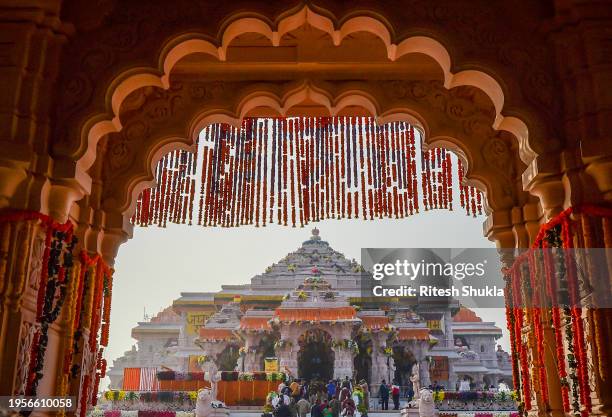 Devotees queue to get glimpse of a statue of the hindu god Ram one day after consecration ceremony of the Ram Mandir on January 23, 2024 in Ayodhya,...