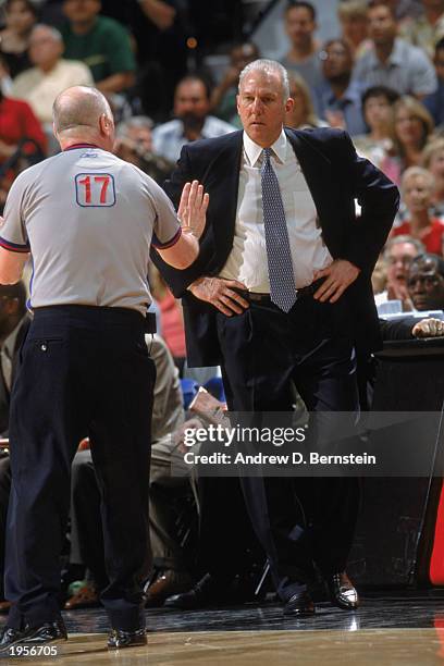 Head Coach of the San Antonio Spurs Gregg Popovich talks with official Joe Crawford during Game Two of the Western Conference Quarterfinals against...