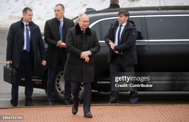 Russian President Vladimir Putin, surrounded by his bodyguards, leaves the car prior to placing flowers on the memorial of the battlefield of Nevsky...