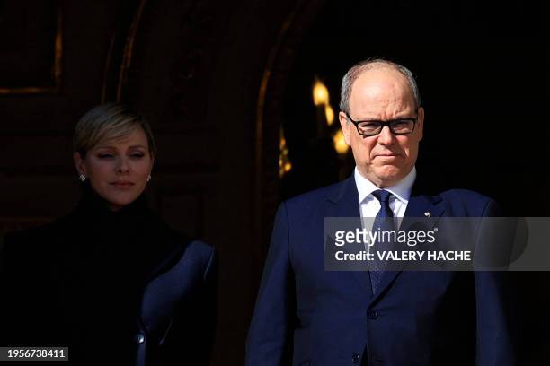 Princess Charlene of Monaco and Prince's Albert II of Monaco appear on the balcony during the traditional festivities of Sainte Devote in the...