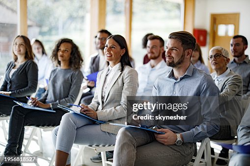 Crowd of business people having a seminar in board room. Crowd of business people having a seminar in board room.