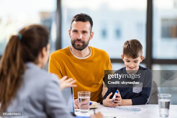 single father and his son having a counseling session. - focus group stock pictures, royalty-free photos & images