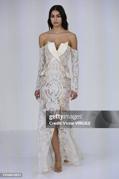 Model walks the runway during the Alexis Mabille Haute Couture Spring/Summer 2024 fashion show as part of Paris Fashion Week on January 23, 2024 in...