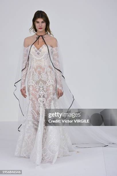 Model walks the runway during the Alexis Mabille Haute Couture Spring/Summer 2024 fashion show as part of Paris Fashion Week on January 23, 2024 in...