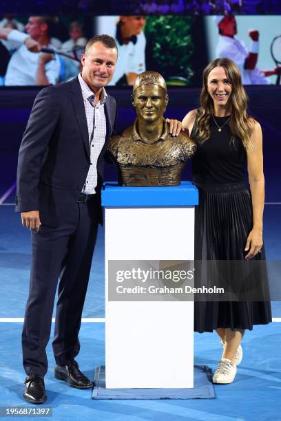 Lleyton and Bec Hewitt pose after Lleyton is inducted into Australian Tennis Hall of Fame on Rod Laver Arena during the 2024 Australian Open at...