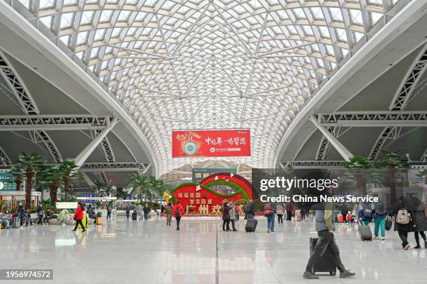 Travelers are seen at the waiting hall of Guangzhou South Railway Station ahead of the Spring Festival travel rush on January 24, 2024 in Guangzhou,...