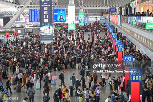 Travelers are seen at the waiting hall of Guangzhou South Railway Station ahead of the Spring Festival travel rush on January 24, 2024 in Guangzhou,...