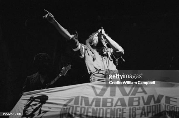 Jamaican Reggae musician Bob Marley performing on stage, with his band, during the 'Viva Zimbabwe' independence celebration at Ruffaro Stadium,...