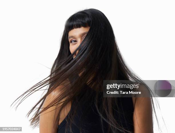 woman with windswept hair - capelli neri foto e immagini stock