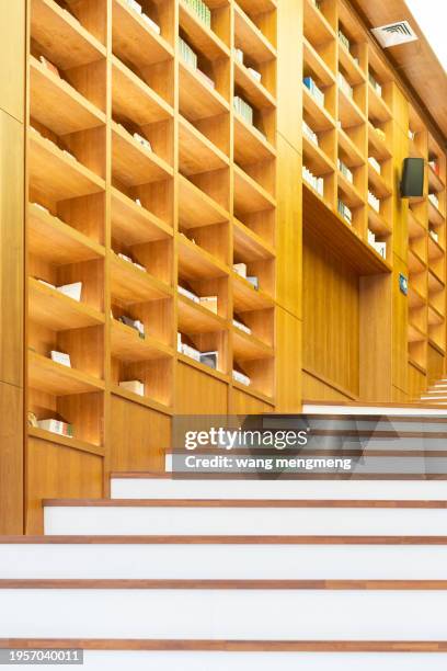 bookcase next to the wooden staircase - trapezoid stock pictures, royalty-free photos & images