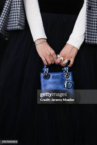 Tina Odjaghian seen wearing white / navy blue butterfly print pattern sweater, white / black houndstooth pattern blazer jacket, black tulle pleated...