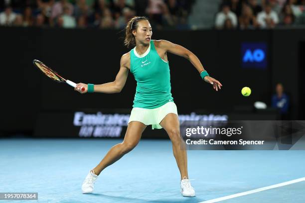 Qinwen Zheng of China plays a forehand during their quarterfinals singles match against Anna Kalinskaya during the 2024 Australian Open at Melbourne...