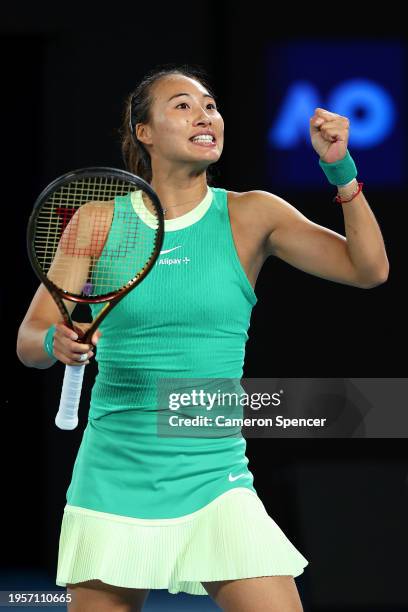 Qinwen Zheng of China celebrates winning match point during their quarterfinals singles match against Anna Kalinskaya during the 2024 Australian Open...