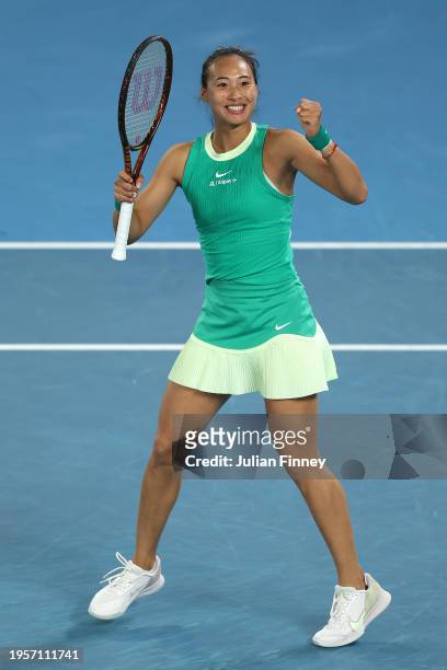 Qinwen Zheng of China celebrates winning match point during their quarterfinals singles match against Anna Kalinskaya during the 2024 Australian Open...