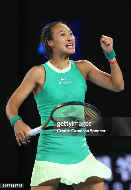 Qinwen Zheng of China celebrates winning match point during their quarterfinals singles match against Anna Kalinskaya during the 2024 Australian Open...