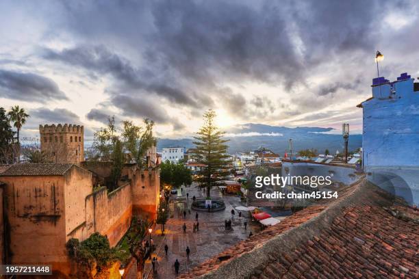 sunset over chefchaouen medina in morocco. travel destination in morocco. - chefchaouen medina stock pictures, royalty-free photos & images