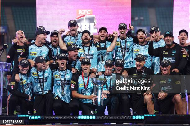 Brisbane Heat hold aloft the BBL trophy and celebrate victory during the BBL Final match between Sydney Sixers and Brisbane Heat at Sydney Cricket...
