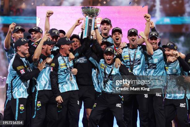 Brisbane Heat hold aloft the BBL trophy and celebrate victory during the BBL Final match between Sydney Sixers and Brisbane Heat at Sydney Cricket...