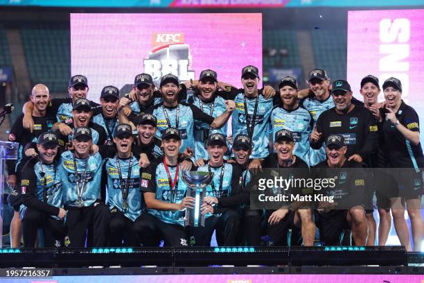 Brisbane Heat hold aloft the BBL trophy and celebrate victory during the BBL Final match between Sydney Sixers and Brisbane Heat at Sydney Cricket...