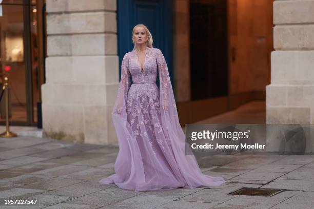 Palina Kozyrava seen wearing Natkina silver / pink diamond earrings, Rami Al Ali pastel lilac / purple embroidered belted transparent tulle long...